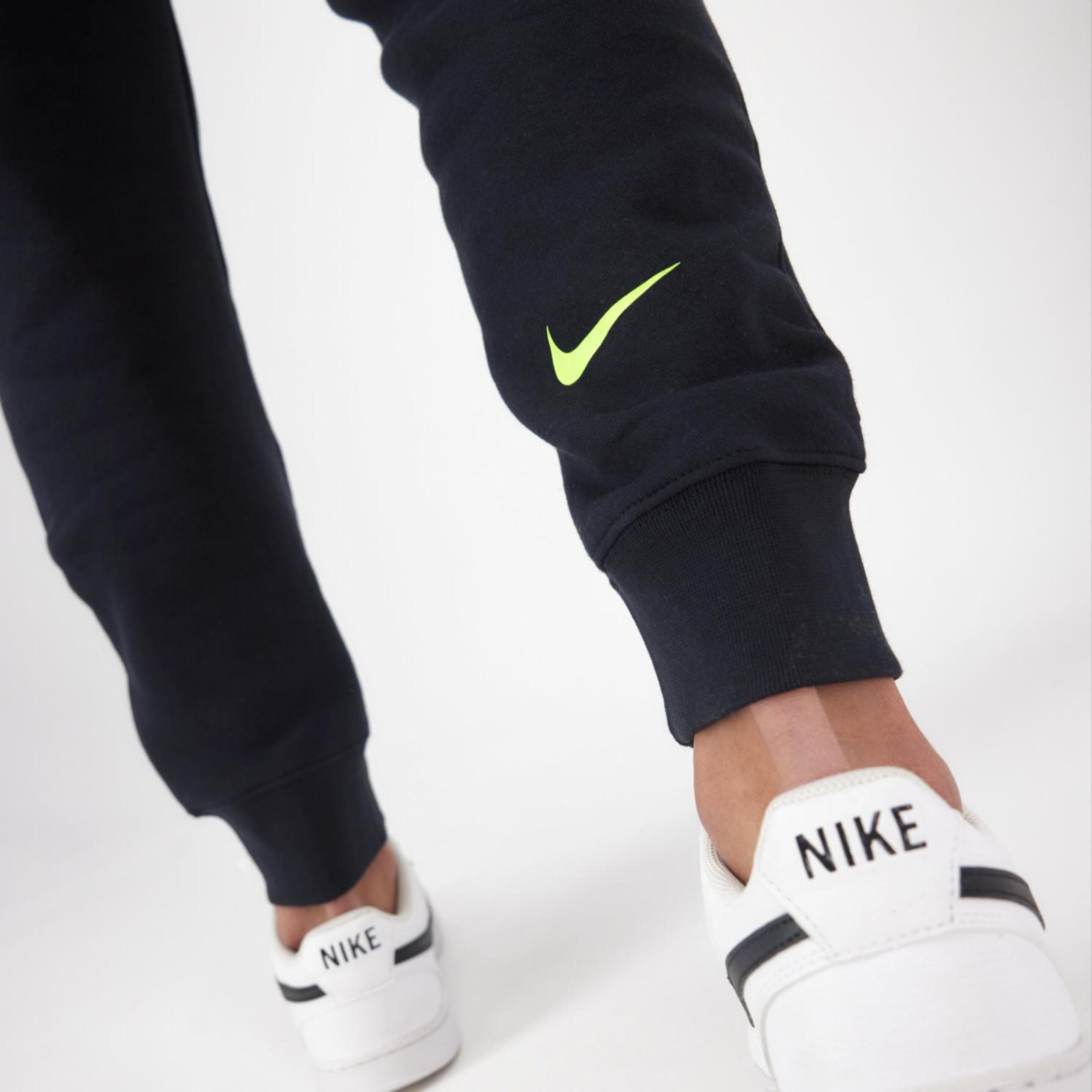 Nike T100
