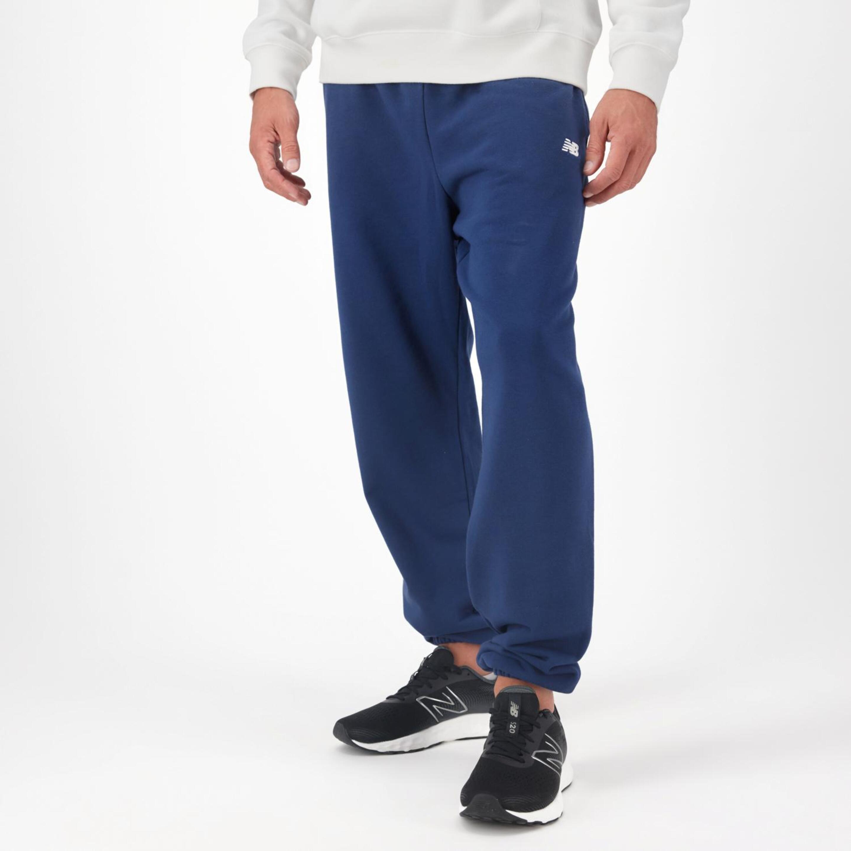New Balance Core - azul - Pantalón Puño Hombre