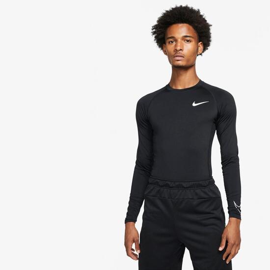 Persona a cargo del juego deportivo Barra oblicua codo Nike Pro - Negro - Camiseta Compresión | Sprinter